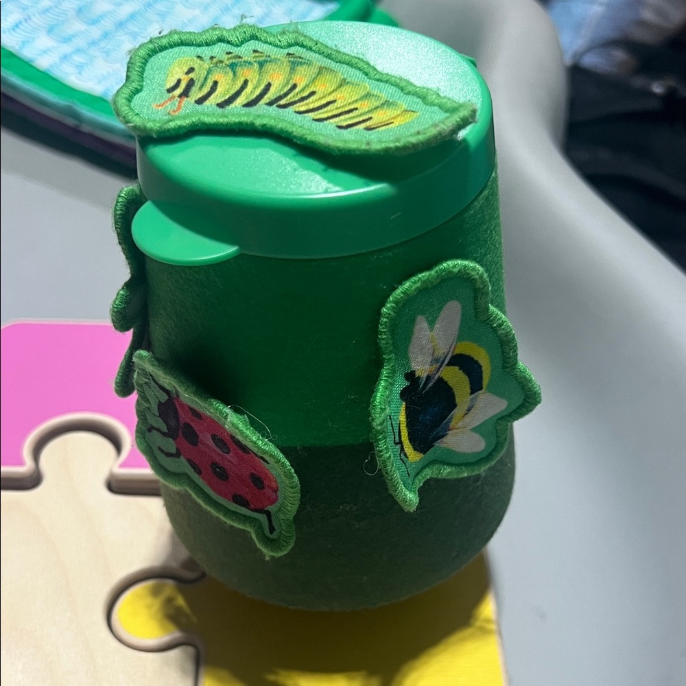 Lovevery Green Kids Toy Cup with Bug Patches